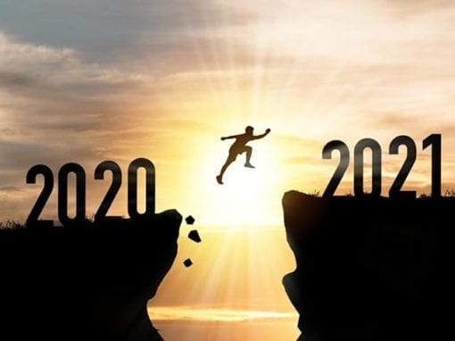 Silhouette of a person leaping from a cliff labeled 2020 to another labeled 2021, with the sun setting in the background, symbolizes hope and protecting health in 2021.