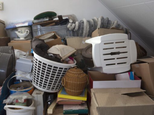 Cluttered Space Filled with Boxes, a Laundry Basket Overflowing with Clothes