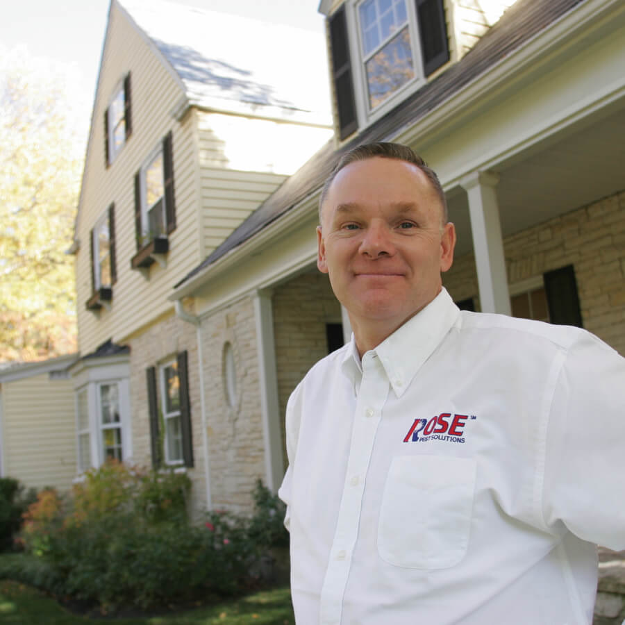 rose-pest-img-38 A Pest Control Technician Outside of the House after Pest Service in Northfield, IL