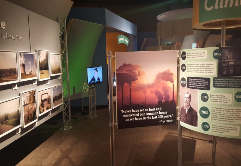 Chicago exhibit featuring photos of climate change and details about environmental issues.