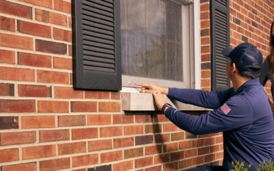 rose pest solutions technician showing homeowner a tear in a window screen where potential mice could get in
