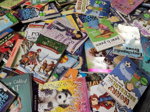 A large pile of assorted children's books, including titles like